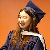 Headshot of Chenyi Huang wearing academic regalia