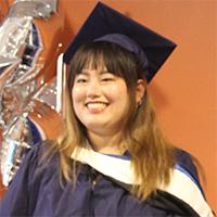 A headshot of Zoey Liu wearing graduate academic regalia