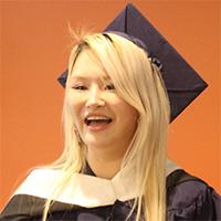 Headshot of Artemis Qi in graduate academic regalia