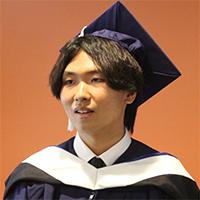 Headshot of Ziqi Wan wearing graduate academic regalia